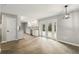 Expansive living space featuring direct access to the kitchen and the rear covered patio through double doors at 100 Des Pinar Ln, Longwood, FL 32750