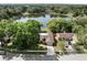 Aerial view showcases property nestled among trees with a lake at 1017 American Beauty St, Orlando, FL 32818