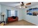 Cozy bedroom with large window seat, and ceiling fan at 1017 American Beauty St, Orlando, FL 32818