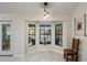 Bright breakfast nook with bay windows offering scenic views, tiled floors, and natural light at 1017 American Beauty St, Orlando, FL 32818
