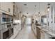 Well-equipped kitchen featuring stainless steel appliances, granite countertops, and a spacious island at 1017 American Beauty St, Orlando, FL 32818