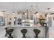 Spacious kitchen island with seating, pendant lighting, granite countertops, and open layout at 1017 American Beauty St, Orlando, FL 32818