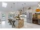 Bright, updated kitchen featuring a large island, stainless steel appliances, and sleek white cabinetry at 1017 American Beauty St, Orlando, FL 32818