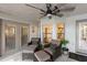 Cozy screened patio with comfortable seating, ceiling fan, and tile flooring at 1017 American Beauty St, Orlando, FL 32818