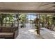 Spacious screened patio with travertine flooring offering scenic lake views at 1017 American Beauty St, Orlando, FL 32818