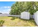 Spacious backyard featuring a storage shed and a well-maintained fence at 113 St Thomas Dr, Mulberry, FL 33860