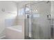 Bathroom showcasing a separate shower and soaking tub, creating a serene and relaxing atmosphere at 113 St Thomas Dr, Mulberry, FL 33860