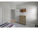 Bedroom featuring neutral walls, dresser and television at 113 St Thomas Dr, Mulberry, FL 33860