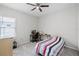 Bedroom with a ceiling fan and carpet flooring at 113 St Thomas Dr, Mulberry, FL 33860