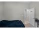 Bedroom with blue bedspread and closet entrance at 113 St Thomas Dr, Mulberry, FL 33860