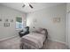 Cozy bedroom with carpeted floors, a comfortable recliner, and a relaxing atmosphere at 113 St Thomas Dr, Mulberry, FL 33860