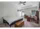 Spacious bedroom with a ceiling fan and a comfortable bed, creating a relaxing retreat at 113 St Thomas Dr, Mulberry, FL 33860