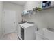 Laundry room with washer, dryer and shelving at 113 St Thomas Dr, Mulberry, FL 33860