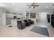 Open-concept living room leading to kitchen with laminate flooring at 113 St Thomas Dr, Mulberry, FL 33860