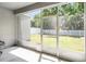 Enclosed patio looking out onto the backyard at 113 St Thomas Dr, Mulberry, FL 33860