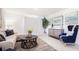 Cozy living room with stylish furniture, artwork, and a comfortable seating arrangement at 114 Tulip Ln, Poinciana, FL 34759