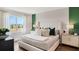 Spacious bedroom filled with natural light, featuring a stylish bed and elegant decor at 1218 Alstonia Ln, Mount Dora, FL 32757