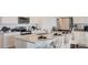 Kitchen showcasing a large island with breakfast bar, stainless steel appliances, and modern white cabinetry at 1218 Alstonia Ln, Mount Dora, FL 32757