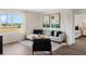 Well-decorated living room with ample natural light, modern decor, and open space at 1218 Alstonia Ln, Mount Dora, FL 32757