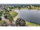 Scenic aerial view showcasing golf course and lake at 1309 Carolina Ct, The Villages, FL 32162