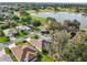 Aerial view highlighting the community's golf course and lake at 1309 Carolina Ct, The Villages, FL 32162