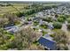 Aerial view showcases the neighborhood's lush landscaping at 1309 Carolina Ct, The Villages, FL 32162