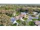 Aerial view of home situated on a well-manicured lot with mature trees at 1309 Carolina Ct, The Villages, FL 32162