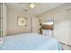 Comfortable bedroom with ceiling fan, closet, and flat screen tv at 1309 Carolina Ct, The Villages, FL 32162