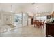 Bright dining room with tile floors, elegant lighting, and open layout, perfect for entertaining at 1309 Carolina Ct, The Villages, FL 32162
