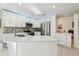 Modern kitchen featuring stainless steel appliances, white cabinets, and quartz countertops at 1309 Carolina Ct, The Villages, FL 32162