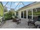 Screened-in porch with seating area, a great space to relax outside at 1309 Carolina Ct, The Villages, FL 32162