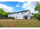 Large fenced backyard, great for outdoor activities and relaxation with a new modern white home at 1340 Crystal Lake E Ave, Orlando, FL 32806