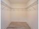 Walk-in closet with wire shelving and wood-look flooring at 1340 Crystal Lake E Ave, Orlando, FL 32806