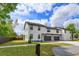 Two-story townhome features a well-maintained lawn, modern design, and a mailbox at 1340 Crystal Lake E Ave, Orlando, FL 32806