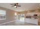 Open concept kitchen with an island, stainless steel appliances, and backyard views at 1340 Crystal Lake E Ave, Orlando, FL 32806