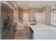 Kitchen with stainless steel appliances, quartz countertops, kitchen island, and modern faucet at 1340 Crystal Lake E Ave, Orlando, FL 32806