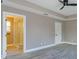 Main bedroom with tray ceiling and ensuite bathroom featuring glass enclosed shower at 1340 Crystal Lake E Ave, Orlando, FL 32806
