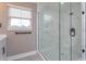 Bathroom featuring glass enclosed shower with white marble-look walls at 1340 Crystal Lake E Ave, Orlando, FL 32806