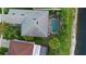 Aerial view of a house with a pool and lake in the backyard at 1430 Clarks Summit Ct, Orlando, FL 32828