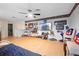 Large bonus room with wood look floors, fan, and decor at 1430 Clarks Summit Ct, Orlando, FL 32828