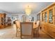 Open dining room with tiled floor, chandelier, wood furniture and bright light at 1430 Clarks Summit Ct, Orlando, FL 32828