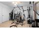 An interior view of a home gym with workout equipment and tiled floors at 1430 Clarks Summit Ct, Orlando, FL 32828