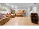 Bright living room featuring tile flooring, comfortable seating, and an open floor plan at 1430 Clarks Summit Ct, Orlando, FL 32828
