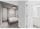 Cozy bedroom featuring soft carpet, modern finishes, and relaxing natural light at 16164 Palm Frond Ave, Clermont, FL 34714