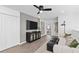 Bright living room showcasing modern decor, wood floors, recessed lighting, and a comfortable seating area at 16164 Palm Frond Ave, Clermont, FL 34714