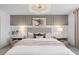 Beautiful main bedroom with plush carpet, stylish lighting, and modern decor at 16164 Palm Frond Ave, Clermont, FL 34714