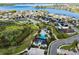 Stunning aerial view of the community near a large lake with multiple amenities and well-kept homes at 1675 Amsel Falls Park Ter, Winter Garden, FL 34787
