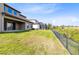 Spacious backyard with a well-maintained lawn and a view of neighboring properties at 1675 Amsel Falls Park Ter, Winter Garden, FL 34787