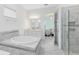 Luxurious bathroom with soaking tub, marble tile, and glass-enclosed shower at 1675 Amsel Falls Park Ter, Winter Garden, FL 34787