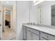 Stylish bathroom vanity with gray cabinets, granite countertop, and neutral finishes at 1675 Amsel Falls Park Ter, Winter Garden, FL 34787